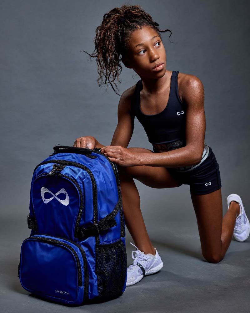 Cheerleader with a blue Nfinity cheer backpack